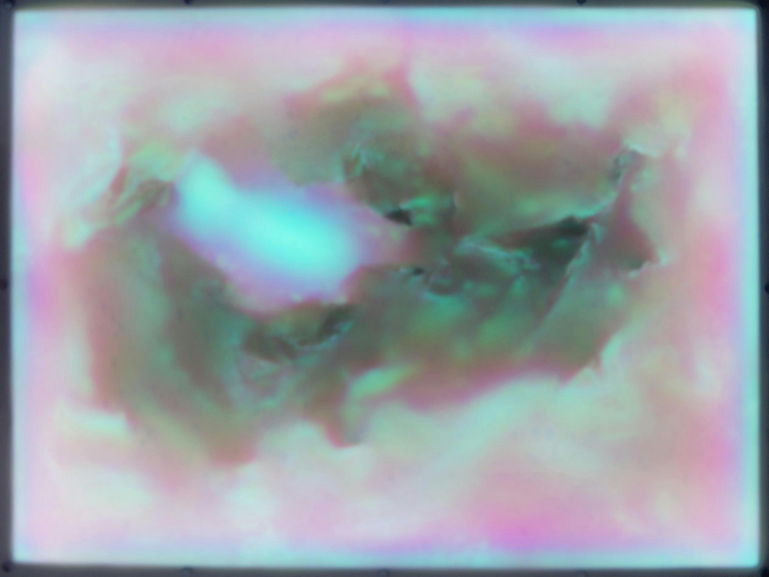A grainy, iridescent, abstracted tunnel, rendered in peaches and pinks around the perimeter and greens and yellows deeper within its interior. The chasm-like form appears both bodily and landscape-like, depicting craggy surfaces that recede into space.